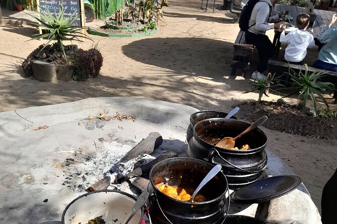 Bicycle or Tuk Tuk Soweto Guided Experience - Lunch at Boma & Outdoor Restaurant: potjie, pap, and braai on the fire