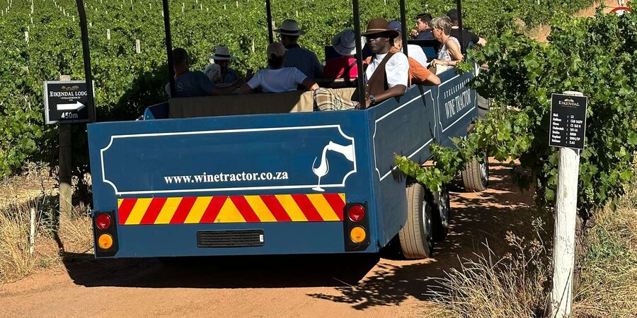 Cape Town: Stellenbosch Hop-On Hop-Off Tractor Transfer - Food, Wine Vouchers, and the Sun on Vineyard Roads