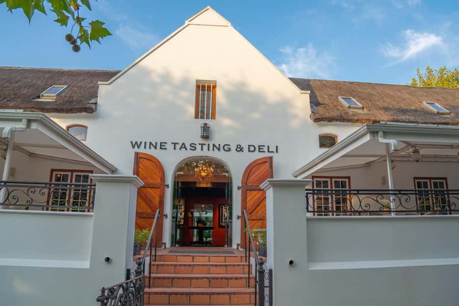 Cape Town: Wine Tram & Winelands Tour with Tastings & Pickup - Stellenbosch: Cape Dutch Streets and Your First Estate Tasting