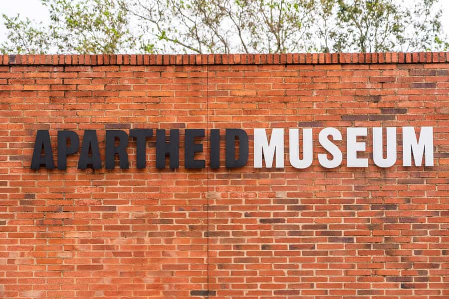 Soweto: Hop-On Hop-Off Bus, City Tour and Apartheid Museum - Start at Rosebank Zone, then ride the double-deck bus with audio
