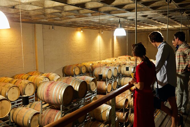 Top 3 Cape Town Wineries Half Day Private Tour - Spier Wine Farm: dam views, Helderberg mountains, and the recycled-bottle chandelier